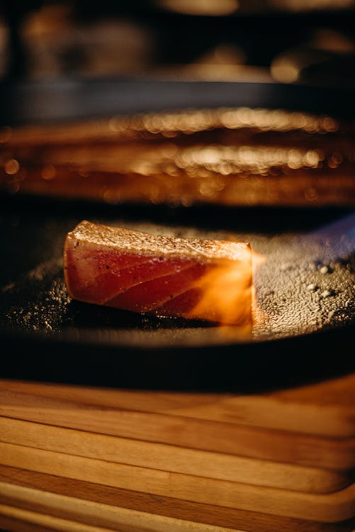 Is Tuna Good For Dogs Tuna steak being seared on pan